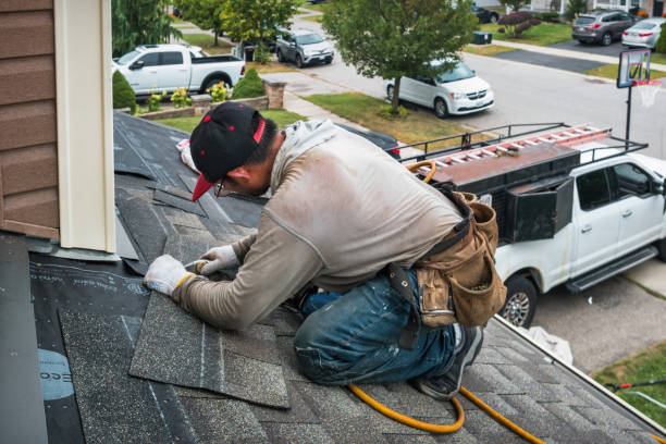 Professional Storm Damage Roof Repair technician working in Loretto, PA